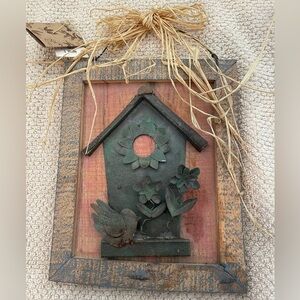 Wood and metal birdhouse picture.